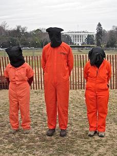 Three campaigners for the closure of Guantánamo outside the White House.